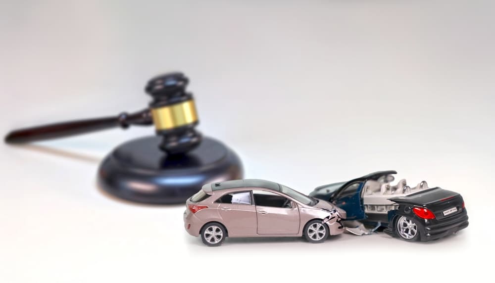 A gavel striking as a verdict is delivered for a traffic accident case.